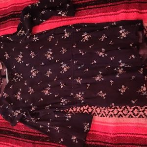 Dark blue romper with flowers on it